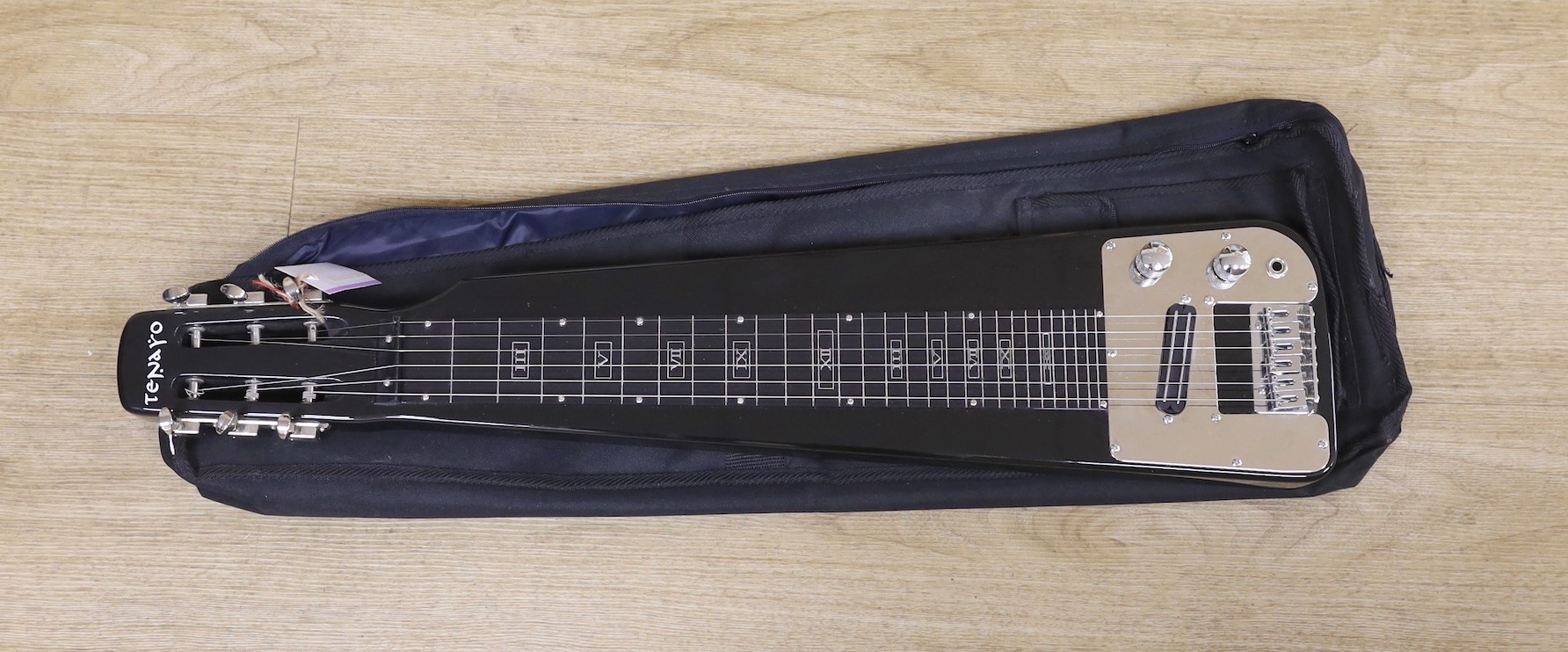 A Tenaro lap steel guitar, 74 cms long.